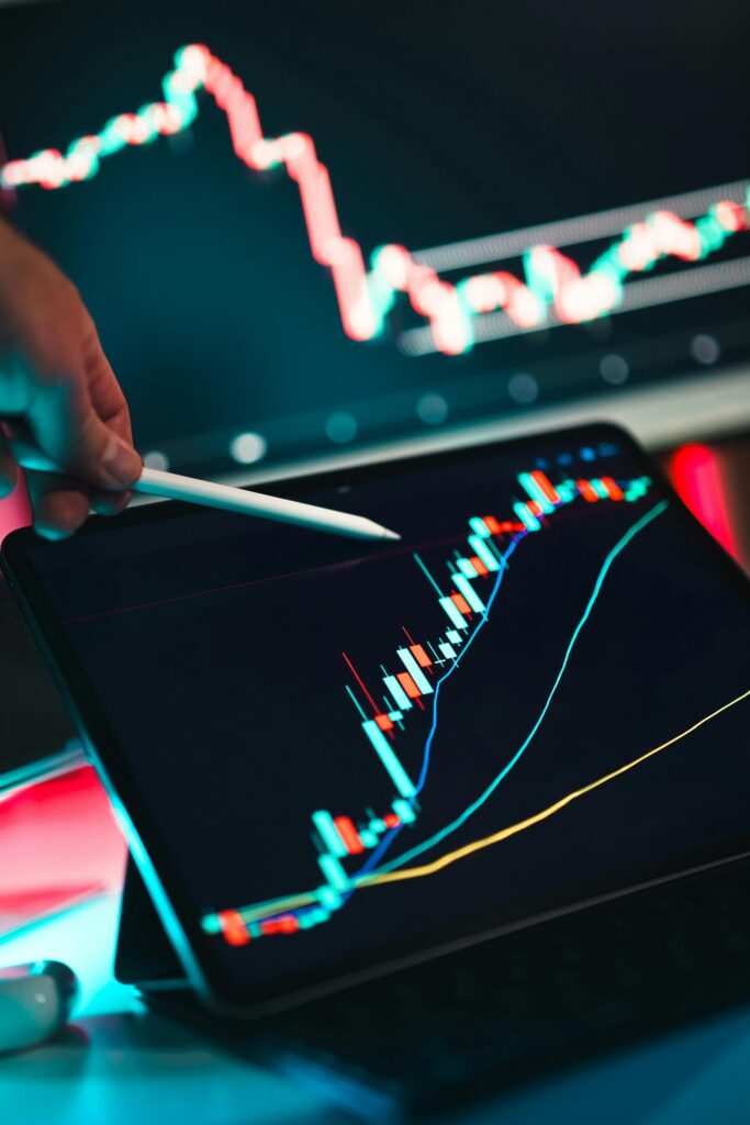 Close-up of cryptocurrency trading analysis on a digital tablet, highlighting market trends.